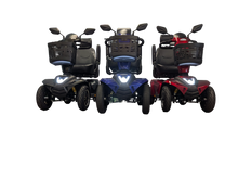 Afbeelding in Gallery-weergave laden, Foto met drie ST5D scootmobielen in drie verschillende kleuren, rood, blauw en antraciet. Ook de led-verlichting is hier heel duidelijk